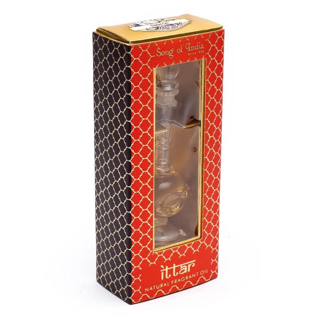 Huile parfumée dans un flacon soufflé à la main roses