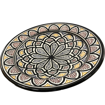 Plat fait main en faïence avec motifs