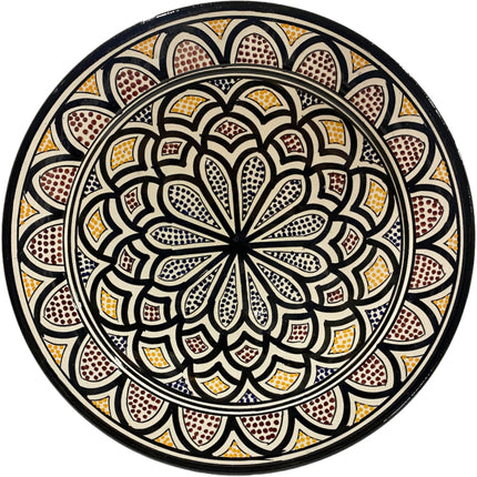 Plat fait main en faïence avec motifs